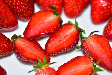 Cut strawberries or Victoria slices close up