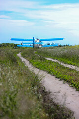 Aeroplane in summer field: commercial and agricultural helicopter service © vita