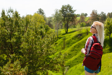 Attractive young woman enjoying her time outside in park, summer