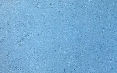 Paper or cardboard sky blue with embossing.