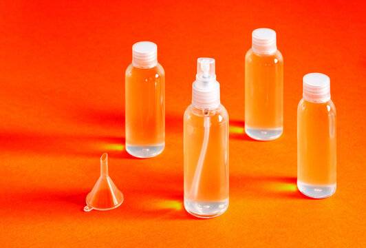 misaligned top view of various clear bottles with hydrochloric gel for filling serves to disinfect the hands of covid-19