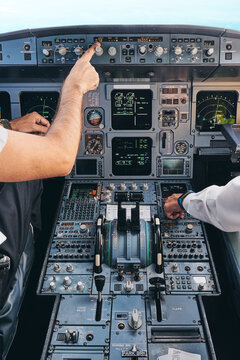 Pilots working in cockpit during flight