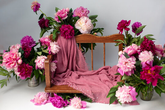 background of the photo zone for shooting. props for photo shoots. wooden bench in peonies