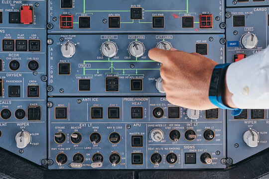 Pilot working with control console during flight