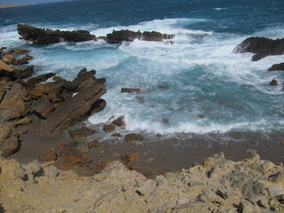 waves breaking on the rocks
