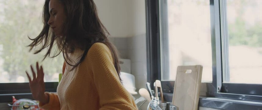 A woman trying to calm down after big fight with her boyfriend, feeling upset