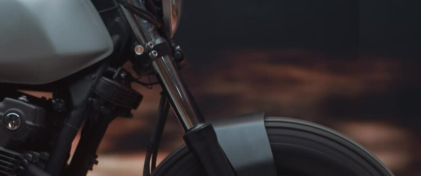 EXTREME CU Vintage custom motorcycle riding fast on a desert mountain road