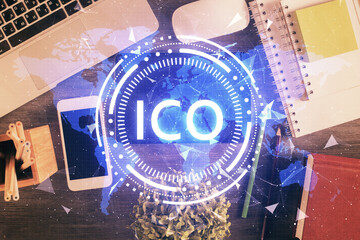Double exposure of blockchain theme hologram over table with phone. Top view. Crypto technology...