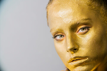 beautiful model girl's, gold metallic skin make-up