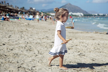 Portrait of a beautiful girl in a white dress