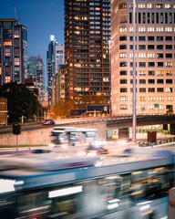 Fototapeta premium Peak hour traffic travelling out of the bustling metropolis city centre. 