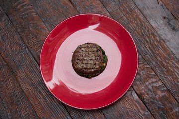 fried meat on a spinach pillow close-up. Dish of meat. Meat food