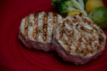 meat cutlets with vegetables close-up on a decorative background. Fried meat, meat dish