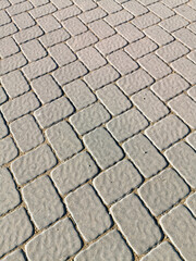 Street is paved with stones and tiles. Beautiful pedestrian zone. The background photo.