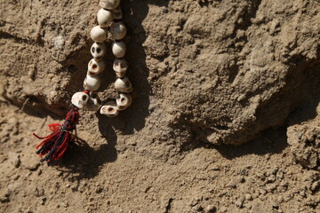 skull beads in the sand