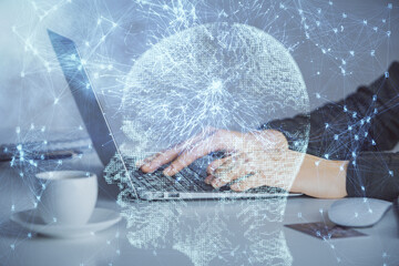 Multi exposure of woman hands working on computer and human brain hologram drawing. Ai tech concept.