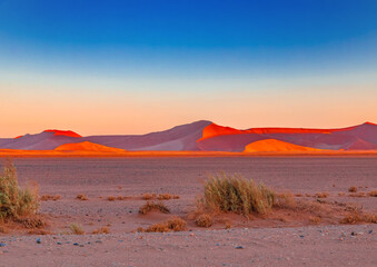 Fototapeta na wymiar Mountains of the Namib Desert in the sunset in Sossusvlei in Namibia