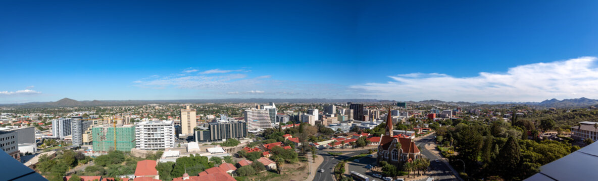 Skyline of Namibia's capital Windhoek with a cloudy sky