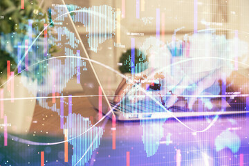 Double exposure of woman hands typing on computer and business theme hologram drawing. Success concept.