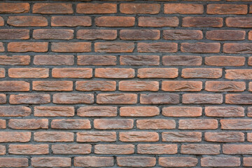 red brick wall texture grunge background with vignetted corners, may use to interior design