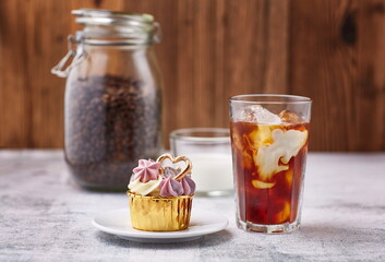 Appetizing cupcake with cream and coffee