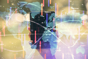 Double exposure of business theme sketch hologram and woman holding and using a mobile device.
