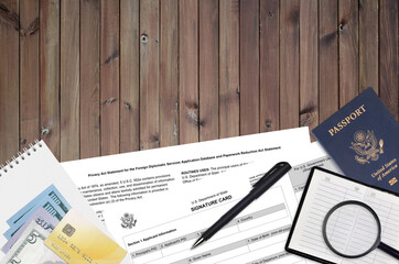 Department of State form DS4139 Signature card lies on table and ready to fill. Paperwork during...