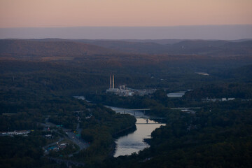 Drone shot of Delaware water gap PA river national park during summer fall foliage with sunset on the side of forest mountain 