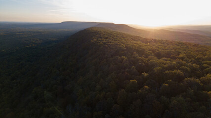 Drone shot of Delaware water gap PA river national park during summer fall foliage with sunset on the mountain side of forest view 