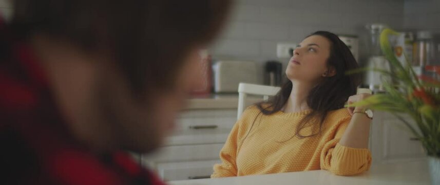 Couple feeling upset and hurt after having a big fight in the kitchen at home. Breaking up, cheating, jealousy, divorce concept. Shallow DOF, Slow motion, BMPCC 4K