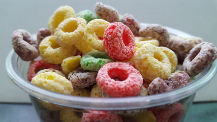 Bowl of colored fruit loops cereal  