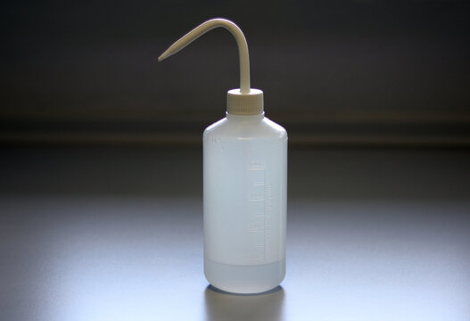 Wash bottle made up of polyethylene (PE), using for rinse pieces of laboratory glassware, test tubes, round bottom flasks. Wash bottles filled with a range of common laboratory solvents and reagents.