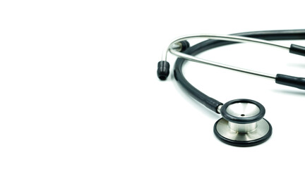 Close-up of Black stethoscope of doctor for a checkup on white background. Stethoscope equipment of medical use to diagnose hear sound. Health care and cardiology concept with copy space.