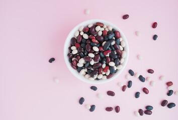 raw beans in a cup on the background