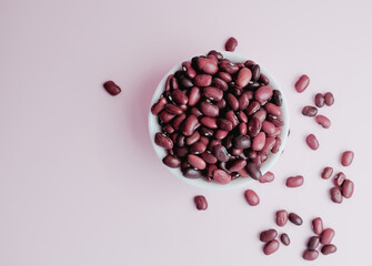 raw beans in a cup on the background