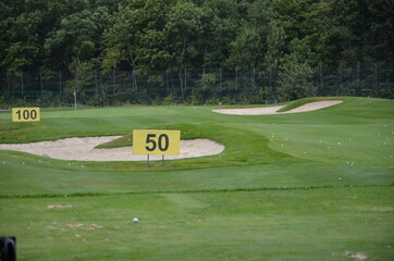 golf course with hole and green grass