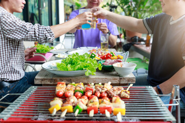 Close up barbecue grill with various kinds of meat.