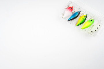 Creative arrangements of wobbler lures. Fishing lure with hooks. Plastic fish with hooks. Flat lay...