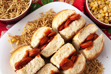 mini hot dogs with tomato sauce, potato sticks and corn