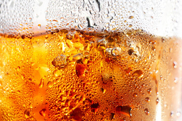 Refreshing Bubbly Soda Pop with Ice Cubes. Cold soda iced drink in a glasses - Selective focus