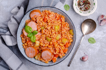 Stewed rice with beans, sausages and vegetables