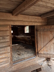 Fototapeta na wymiar Open door to an old wooden barn - Flå, Bjørneparken 