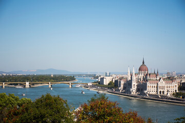 Naklejka na ściany i meble View landscape and cityscape of Budapest old town city and Hungarian Parliament with tour cruises in Danube Delta river and Budapest Chain Bridge in Budapest, Hungary