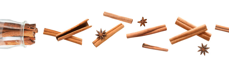 Cup of coffee with cinnamon on white background