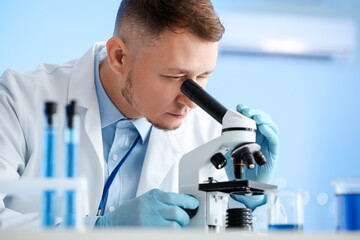 Scientist working with sample in laboratory