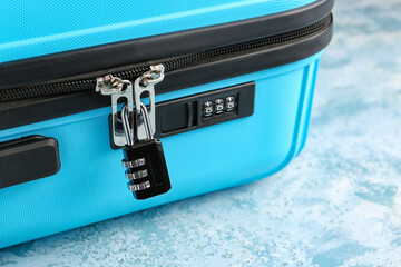 Suitcase with lock on color background, closeup - Powered by Adobe