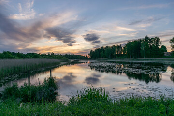 Fototapeta premium picture with beautiful colorful sunset over the lake, a wonderful place of strength and energy, peace, harmony and quiet