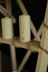 wax candles stand on a shelf