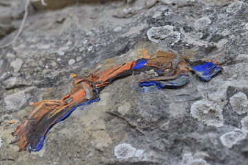 The graffiti art on the old rock wall in Italy