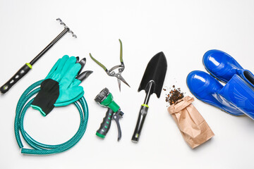 Set of gardening supplies on white background